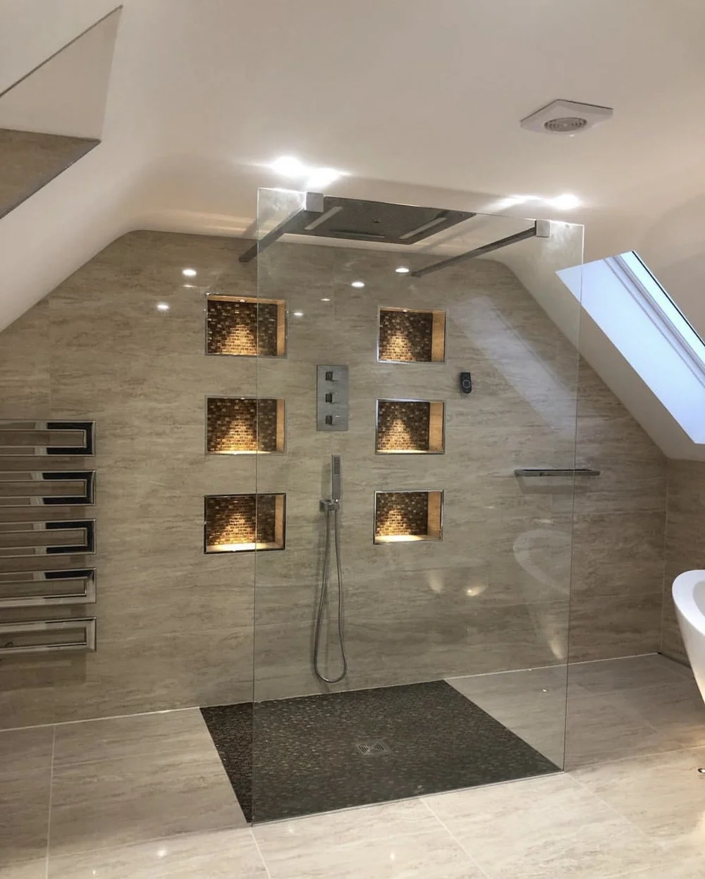 Luxury walk-in shower with illuminated niches